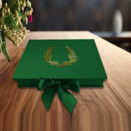 Gold foil wreath on a green wrapped box